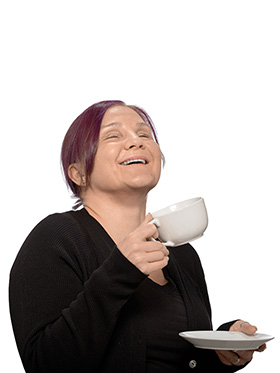 Léonie, holding a tea cup, head back laughing